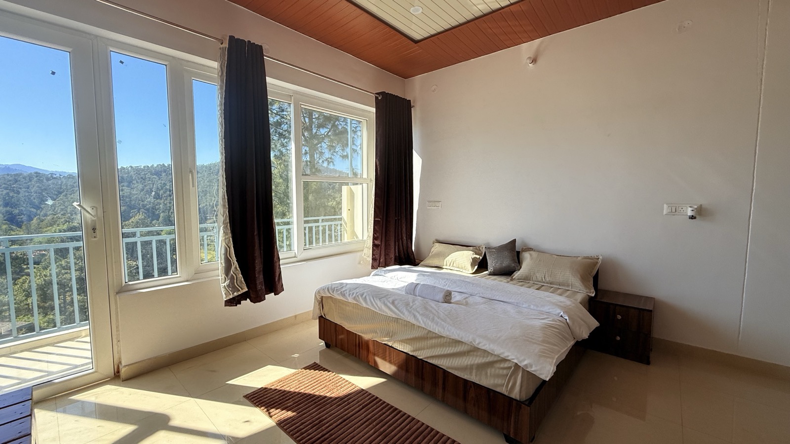 Room with panoramic mountain windows